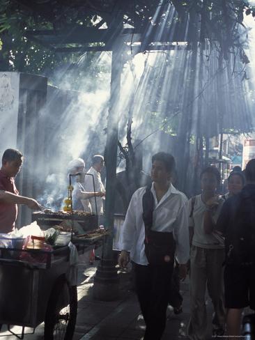 Photographic Print: Street Vendors Selling Grilled Meat to Passers-By on Train Platform, Bangkok, Thailand by Richard Nebesky: 24x18in