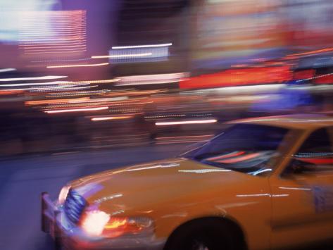 Photographic Print: Blurred View of Taxi Cab in Times Square, NYC by Rudi Von Briel: 24x18in