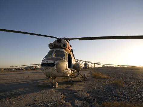 Photographic Print: Iraqi Helicopter Sits on the Flight Deck Abandoned at Camp Warhorse by Stocktrek Images: 24x18in