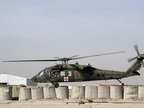 Photographic Print: UH-60 Blackhawk Prepares to Land at Camp Warhorse to Refuel by Stocktrek Images: 24x18in