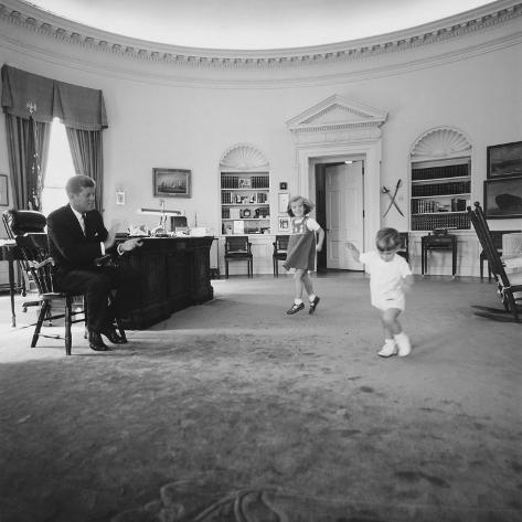 Photo: Caroline and John Jr. Dance in the Oval Office as President Kennedy Claps. 1962: 16x16in