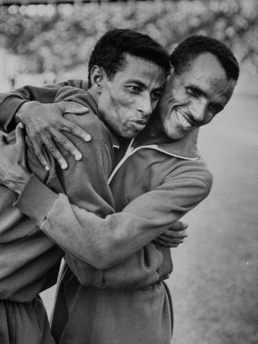 Premium Photographic Print: Ethiopian Runners Abebe Bikila and Mamo Wolde During Exhibition Race at Berlin Olympic Stadium: 24x18in