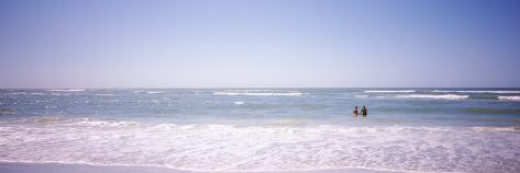 Photographic Print: Couple Standing in Water on the Beach, Gulf of Mexico, Florida, USA: 42x14in