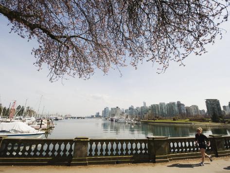 Photographic Print: Jogger Running on the Waterfront in Coal Harbour, Vancouver, British Columbia, Canada by Christian Kober: 24x18in