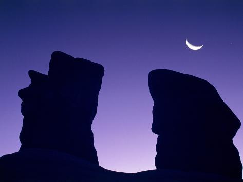 Photographic Print: Rock formation in Devil's Garden at night by Frank Lukasseck: 24x18in