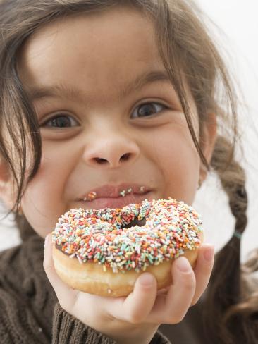 Photographic Print: Girl Holding a Doughnut with Sprinkles, Partly Eaten: 24x18in