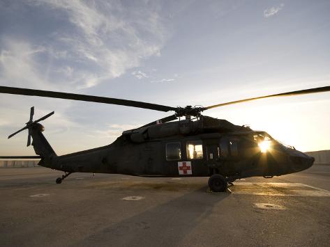 Photographic Print: A UH-60 Blackhawk Medivac Helicopter Sits On the Flight Deck at Camp Warhorse by Stocktrek Images: 24x18in