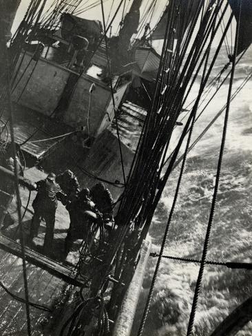 Photographic Print: At the Pumps in a Gale in the Antarctic Ocean, 1912 by Herbert Ponting: 24x18in