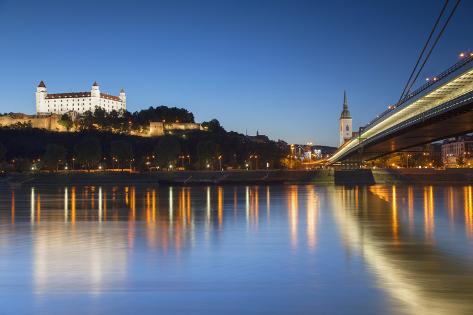 Photographic Print: Bratislava Castle, St Martin's Cathedral and New Bridge at Dusk, Bratislava, Slovakia by Ian Trower: 24x16in