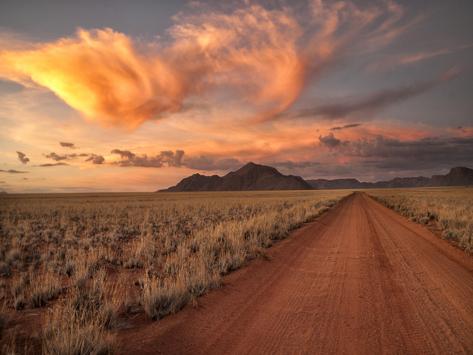 Photographic Print: Dirt Road in the Desert at Sunset with a Colorful Sky, Tiras Mountains, Namibia by Frances Gallogly: 24x18in