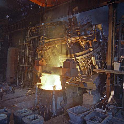 Photographic Print: 75 Ton Arc Furnace Pouring Molten Steel into a Vessel, Sheffield, South Yorkshire, 1969 by Michael Walters: 16x16in