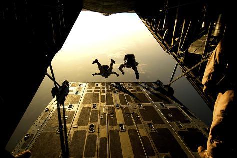 Photographic Print: U.S. Air Force Pararescuemen Jump from an Hc-130 Aircraft Off the Coast of Djibouti by Stocktrek Images: 24x16in