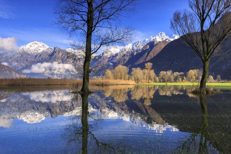 Photographic Print: The Natural Reserve of Pian Di Spagna Flooded with Snowy Peaks Reflected in the Water, Italy by Roberto Moiola: 24x16in