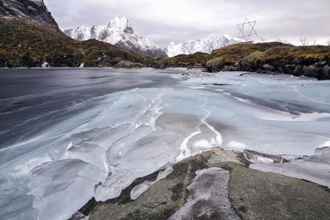 Photographic Print: Frozen Lake Next to Reine, Reinefjorden, Moskenes, Lofoten, Norway by Dieter Meyrl: 24x16in