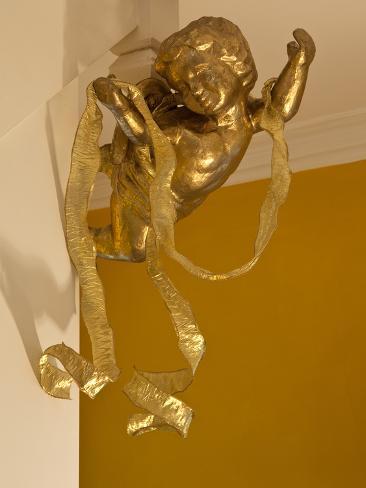 Photo: Gold Ribbon Trailing over Cherub Figure in Corner of Room by Richard Bryant: 24x18in