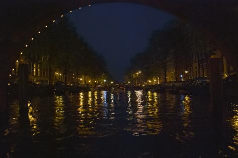 Photographic Print: View of Amsterdam Canal at Night by Anna Miller: 18x12in