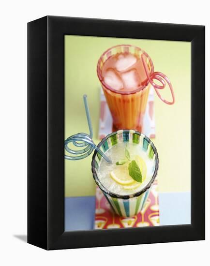 Ice-Cold Lemonade and Pink Grapefruit Juice in Glasses-null-Framed Premier Image Canvas