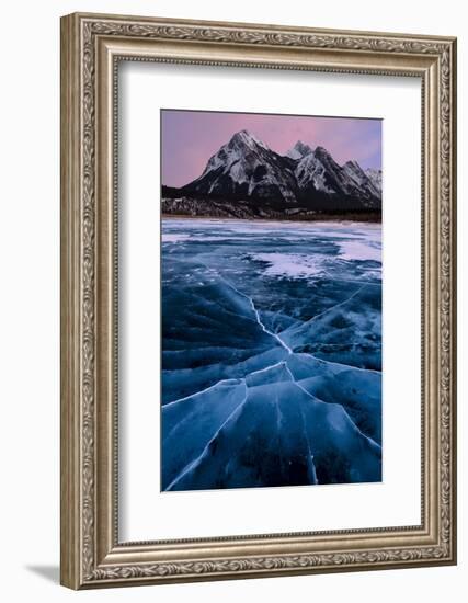 Ice cracks along Abraham Lake in Banff, Canada with purple clouds and scenic mountains-David Chang-Framed Photographic Print