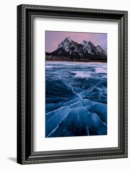 Ice cracks along Abraham Lake in Banff, Canada with purple clouds and scenic mountains-David Chang-Framed Photographic Print