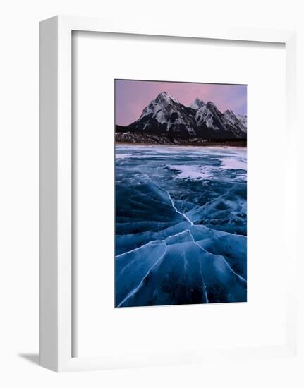 Ice cracks along Abraham Lake in Banff, Canada with purple clouds and scenic mountains-David Chang-Framed Premium Photographic Print