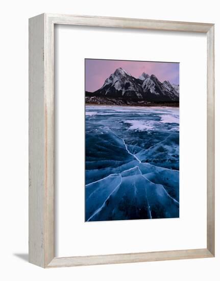 Ice cracks along Abraham Lake in Banff, Canada with purple clouds and scenic mountains-David Chang-Framed Premium Photographic Print