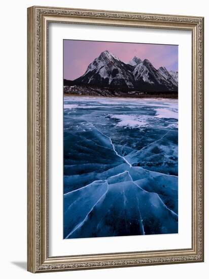 Ice cracks along Abraham Lake in Banff, Canada with purple clouds and scenic mountains-David Chang-Framed Photographic Print