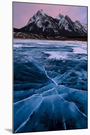 Ice cracks along Abraham Lake in Banff, Canada with purple clouds and scenic mountains-David Chang-Mounted Photographic Print