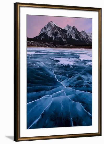 Ice cracks along Abraham Lake in Banff, Canada with purple clouds and scenic mountains-David Chang-Framed Photographic Print