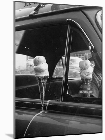 Ice Cream Cone Melting Outside Rolled Up Window of Air Conditioned Car-John Dominis-Mounted Photographic Print