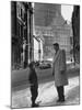 Ice Hockey Player Jean Beliveau, Standing in a Snow Covered Street Speaking to a Child-Yale Joel-Mounted Premium Photographic Print