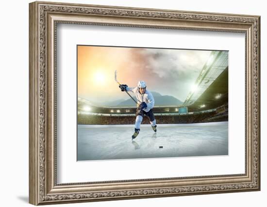 Ice Hockey Player on the Ice. Open Stadium - Winter Classic Game.-Andrey Yurlov-Framed Photographic Print