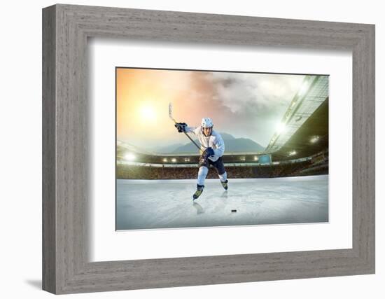 Ice Hockey Player on the Ice. Open Stadium - Winter Classic Game.-Andrey Yurlov-Framed Photographic Print