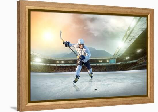 Ice Hockey Player on the Ice. Open Stadium - Winter Classic Game.-Andrey Yurlov-Framed Premier Image Canvas