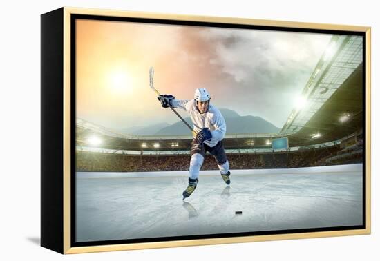 Ice Hockey Player on the Ice. Open Stadium - Winter Classic Game.-Andrey Yurlov-Framed Premier Image Canvas