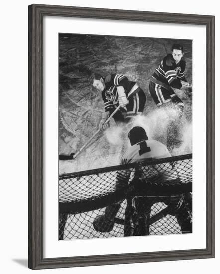 Ice Hockey Players Bill Mosienko and Max Bentley Making a Play Against the Goalie-Frank Scherschel-Framed Premium Photographic Print