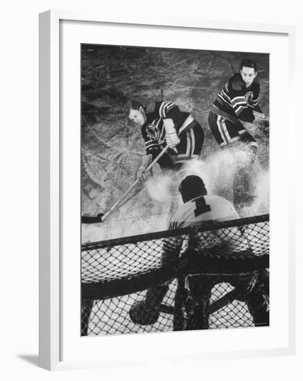 Ice Hockey Players Bill Mosienko and Max Bentley Making a Play Against the Goalie-Frank Scherschel-Framed Premium Photographic Print