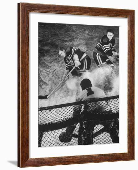 Ice Hockey Players Bill Mosienko and Max Bentley Making a Play Against the Goalie-Frank Scherschel-Framed Premium Photographic Print