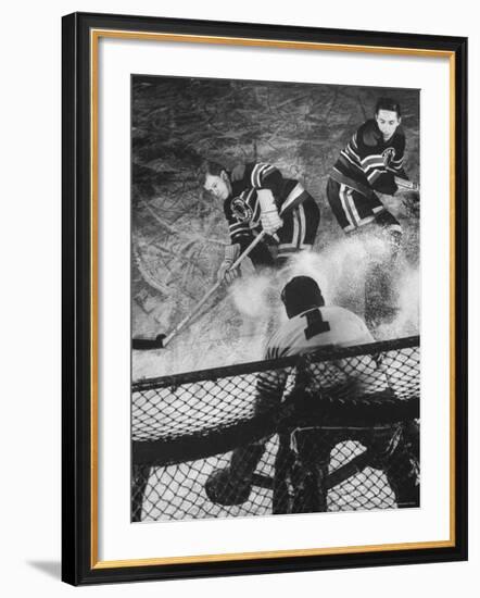 Ice Hockey Players Bill Mosienko and Max Bentley Making a Play Against the Goalie-Frank Scherschel-Framed Premium Photographic Print