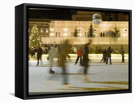 Ice Skating at Night on Ice Rink at Mozartplatz Square, Salzburg, Austria, Europe-Richard Nebesky-Framed Premier Image Canvas