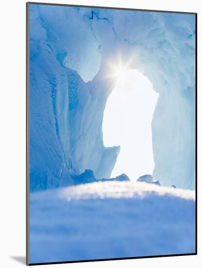 Iceberg frozen into the sea ice of the Uummannaq fjord system during winter. Greenland-Martin Zwick-Mounted Photographic Print