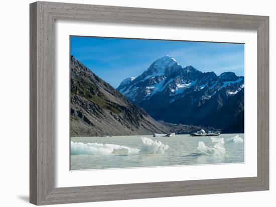 Icebergs float in a cold lake with a large snow covered mountain, South Island, New Zealand-Logan Brown-Framed Photographic Print