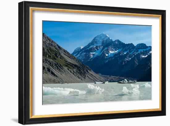 Icebergs float in a cold lake with a large snow covered mountain, South Island, New Zealand-Logan Brown-Framed Photographic Print