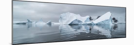 Icebergs floating in the Southern Ocean, Iceberg Graveyard, Lemaire Channel, Antarctic Peninsula...-Panoramic Images-Mounted Photographic Print