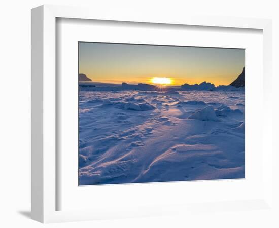 Icebergs frozen into the sea ice of the Uummannaq fjord system during winter. Greenland-Martin Zwick-Framed Photographic Print