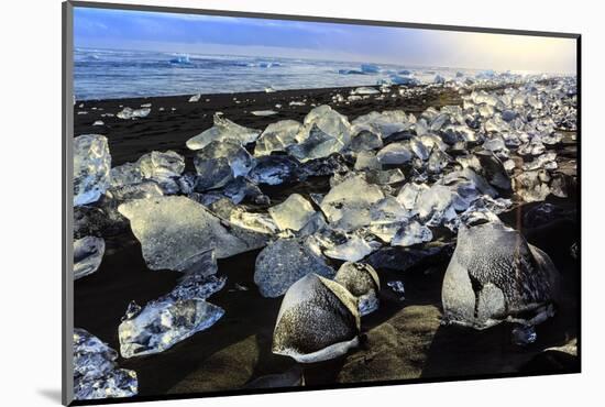 Icebergs on a black sand volcanic beach next to the Jokulsarlon glacial lake in Vatnajokull Nationa-Alex Robinson-Mounted Photographic Print