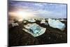 Icebergs on a black sand volcanic beach next to the Jokulsarlon glacial lake in Vatnajokull Nationa-Alex Robinson-Mounted Photographic Print