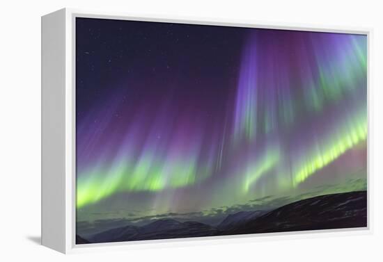 Iceland, Akureyri. The northern lights glow in unbelievable colors.-Ellen Goff-Framed Premier Image Canvas