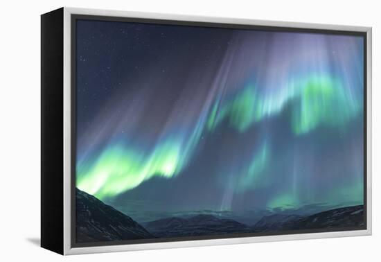 Iceland, Akureyri. The northern lights glow in unbelievable colors.-Ellen Goff-Framed Premier Image Canvas