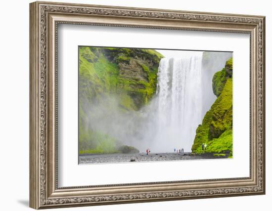 Iceland. South. Skogafoss. Hikers are Skogafoss Waterfall-Inger Hogstrom-Framed Photographic Print