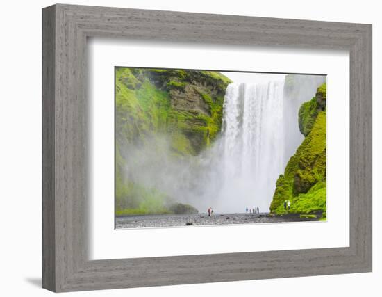 Iceland. South. Skogafoss. Hikers are Skogafoss Waterfall-Inger Hogstrom-Framed Photographic Print